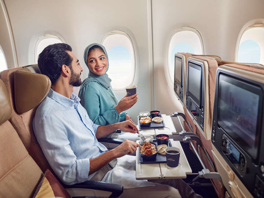 20230417_ETIHAD_A380_ECONOMY_GCC COUPLE_GUEST EATING MEAL_00359_final_v1 copy